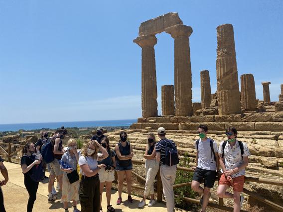 Students sightseeing in front of the Temple of Juno in Sicily, Italy