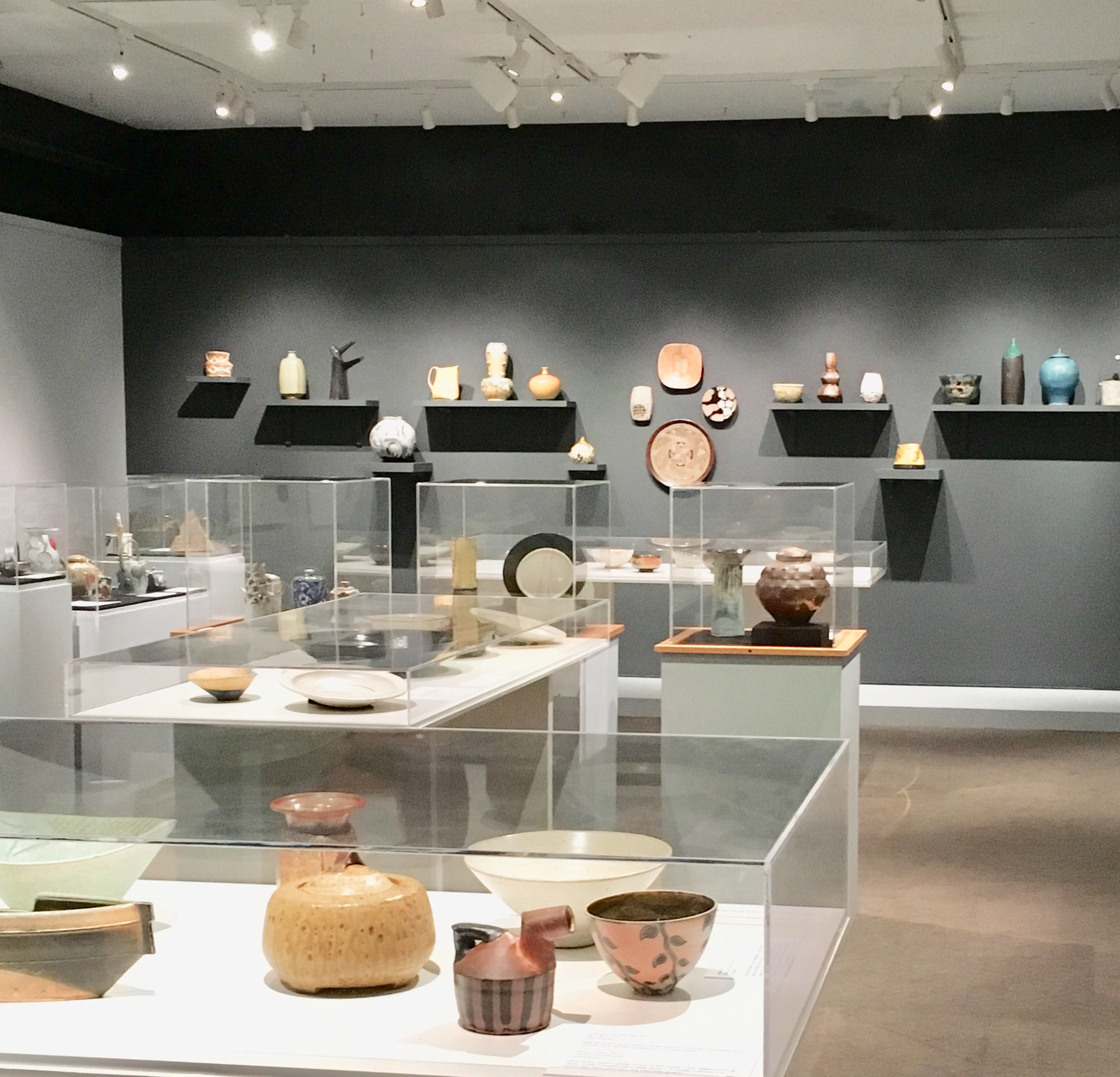 Ruth Crane: A collector's Journey exhibition with various ceramics displayed