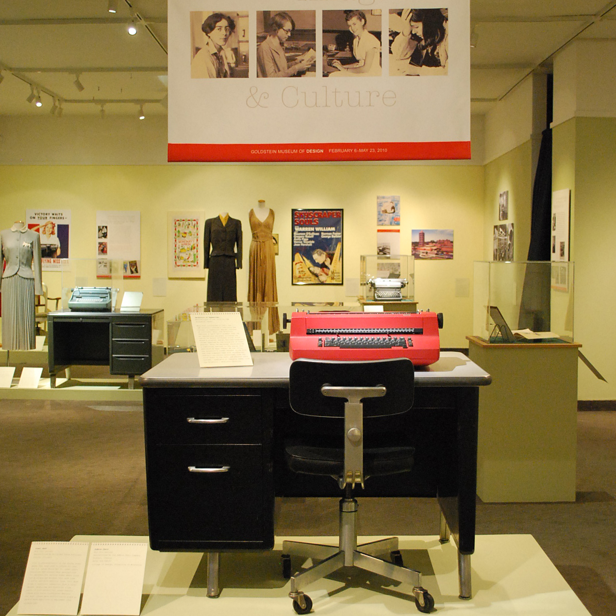 How Secretaries Changed the 20th-Century office: Design, Image, and Culture exhibition with posters, clothing, and furniture on display