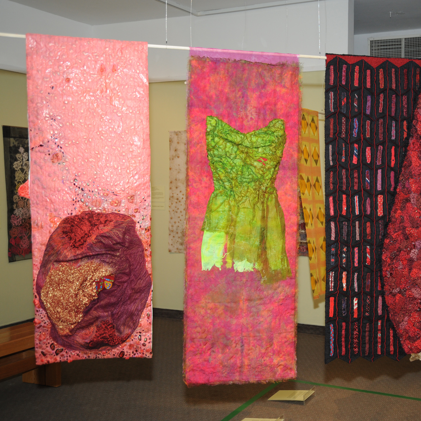 Sum of the Parts Exhibition with surface designs hanging on display