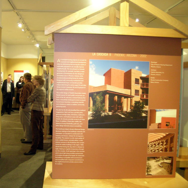 Affordable Housing: Designing an American Asset exhibition opening with people milling about