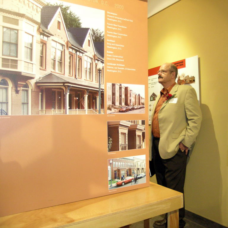 Affordable Housing: Designing an American Asset exhibition opening with people milling about