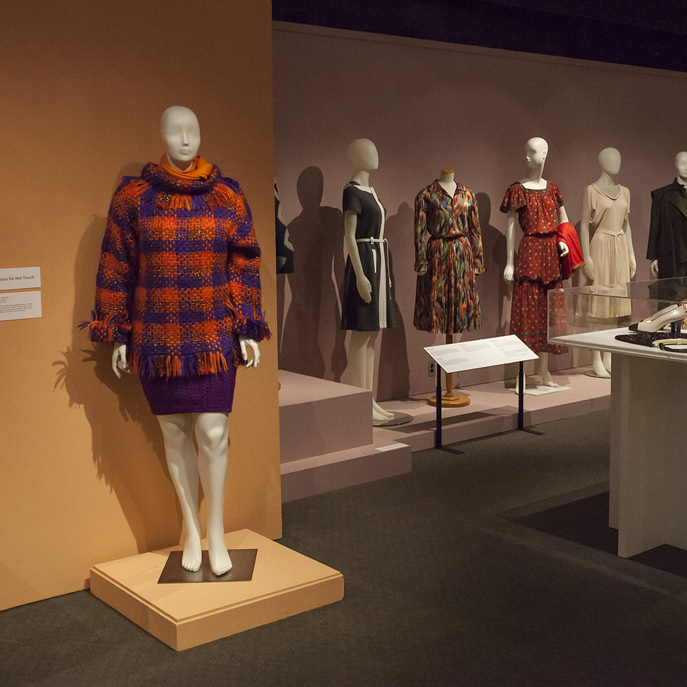 Storied Lives: Women and Their Wardrobes exhibition coat and dresses on mannequins