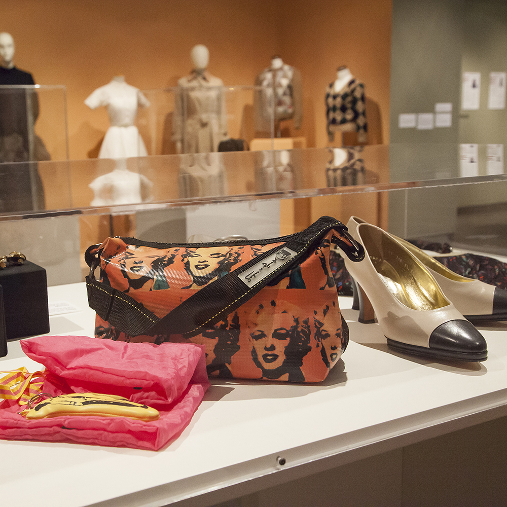 Storied Lives: Women and Their Wardrobes exhibition shoes and purses on display