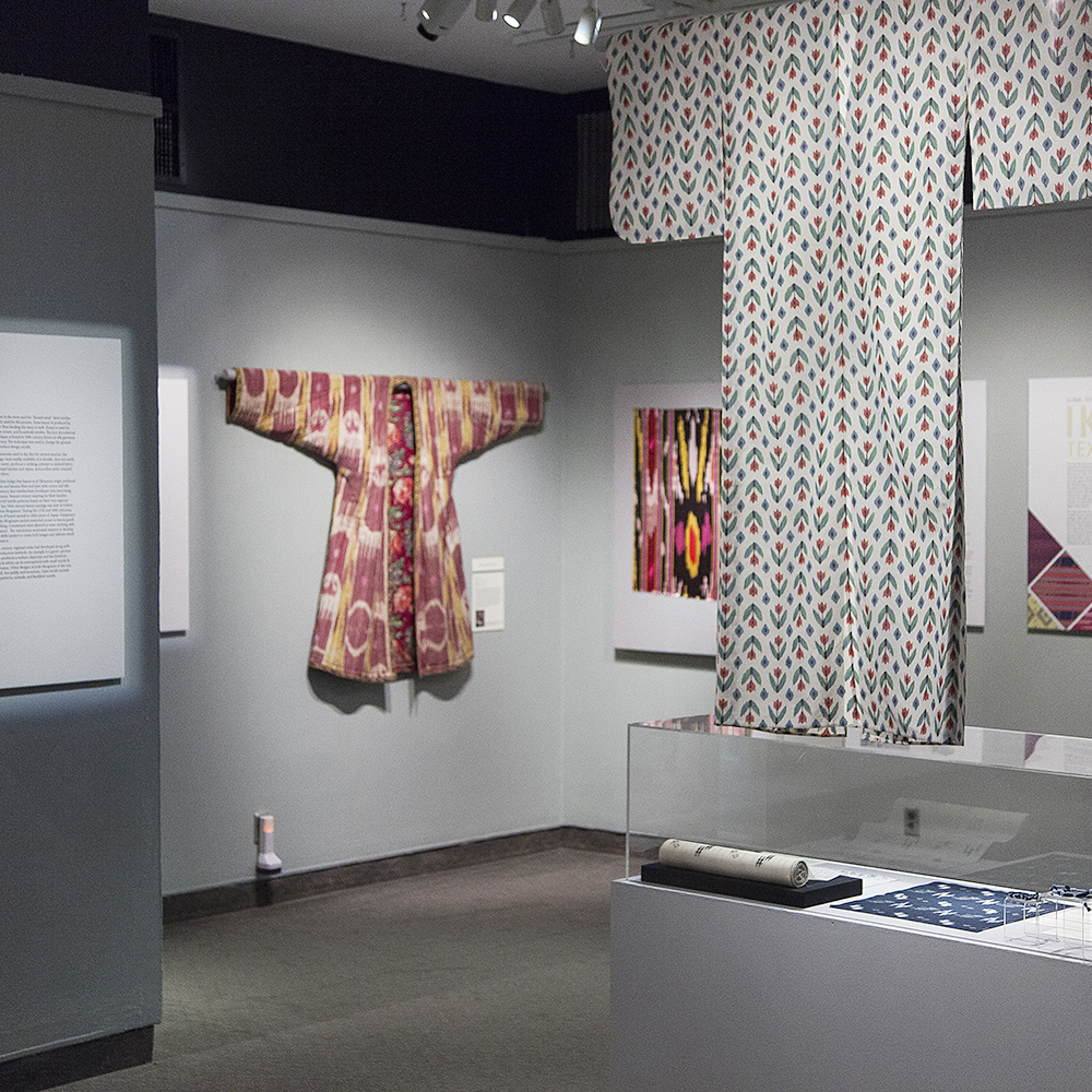 Global Technique, Local Pattern: Ikat Textiles exhibition with textiles hanging