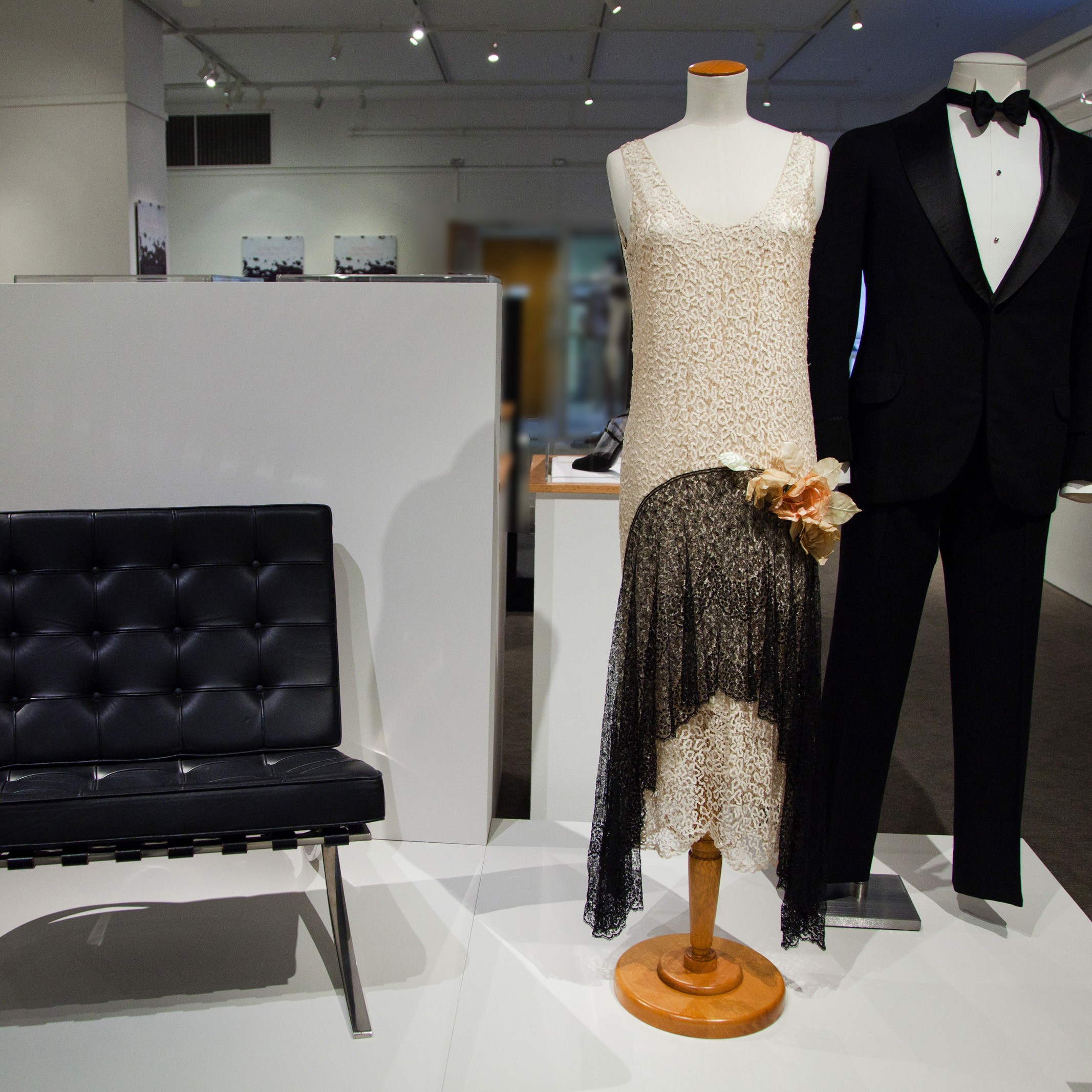 Polarities: Black and White in Design formalwear and an eames chair on display