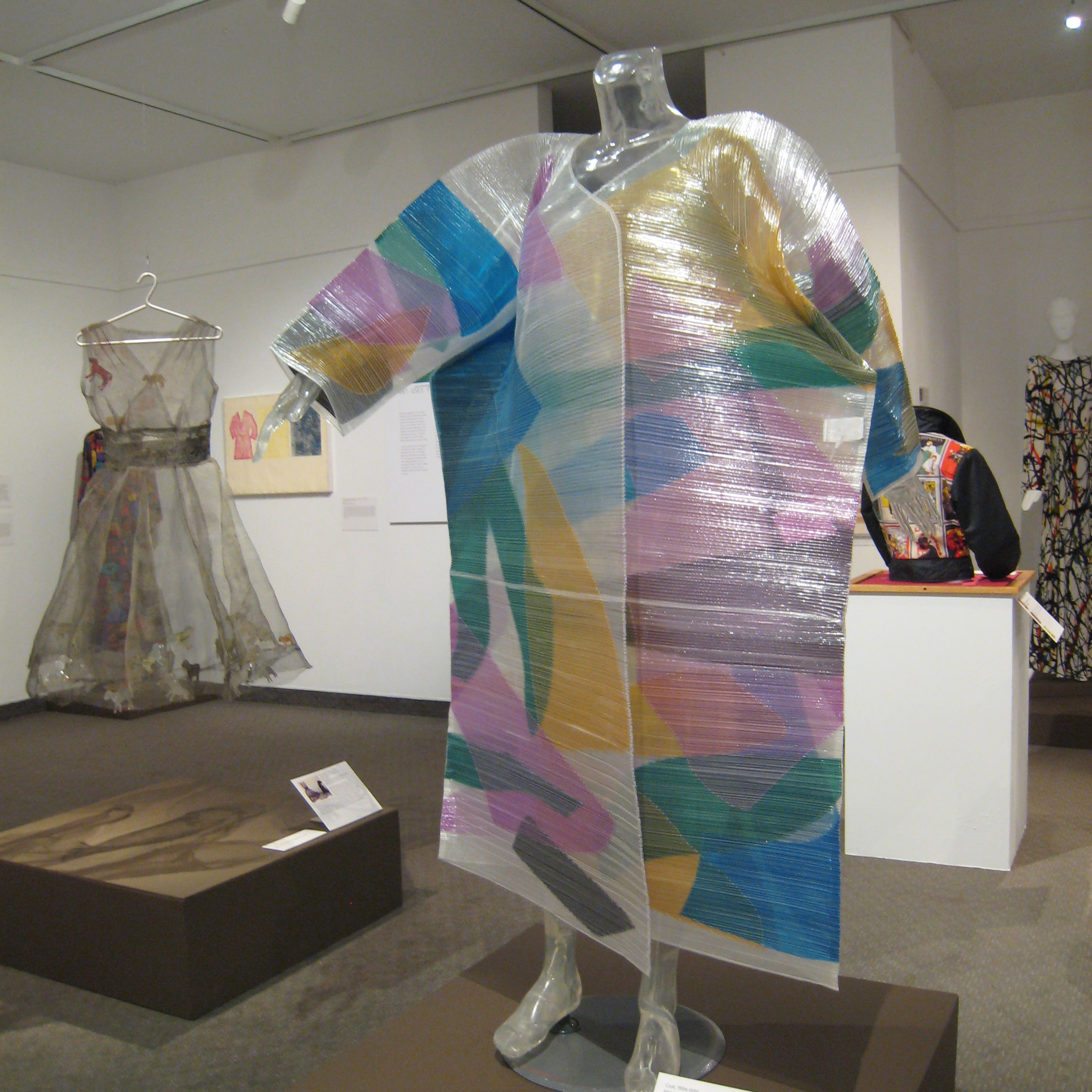 Intersections: Where Art Meets Fashion exhibition with various artistic clothing designs on display