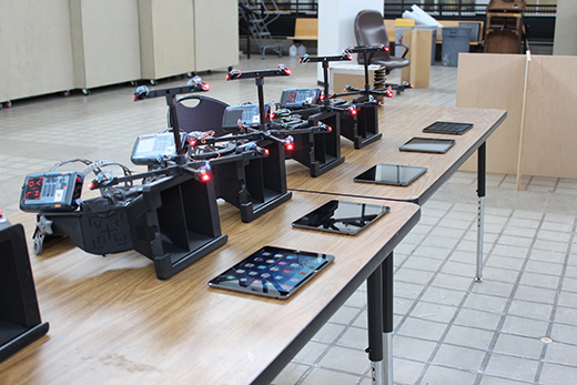 A table laden with iPads and other virtual reality technology