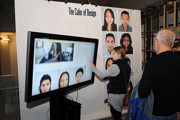Two people look at a project display titled "The Color of Design"