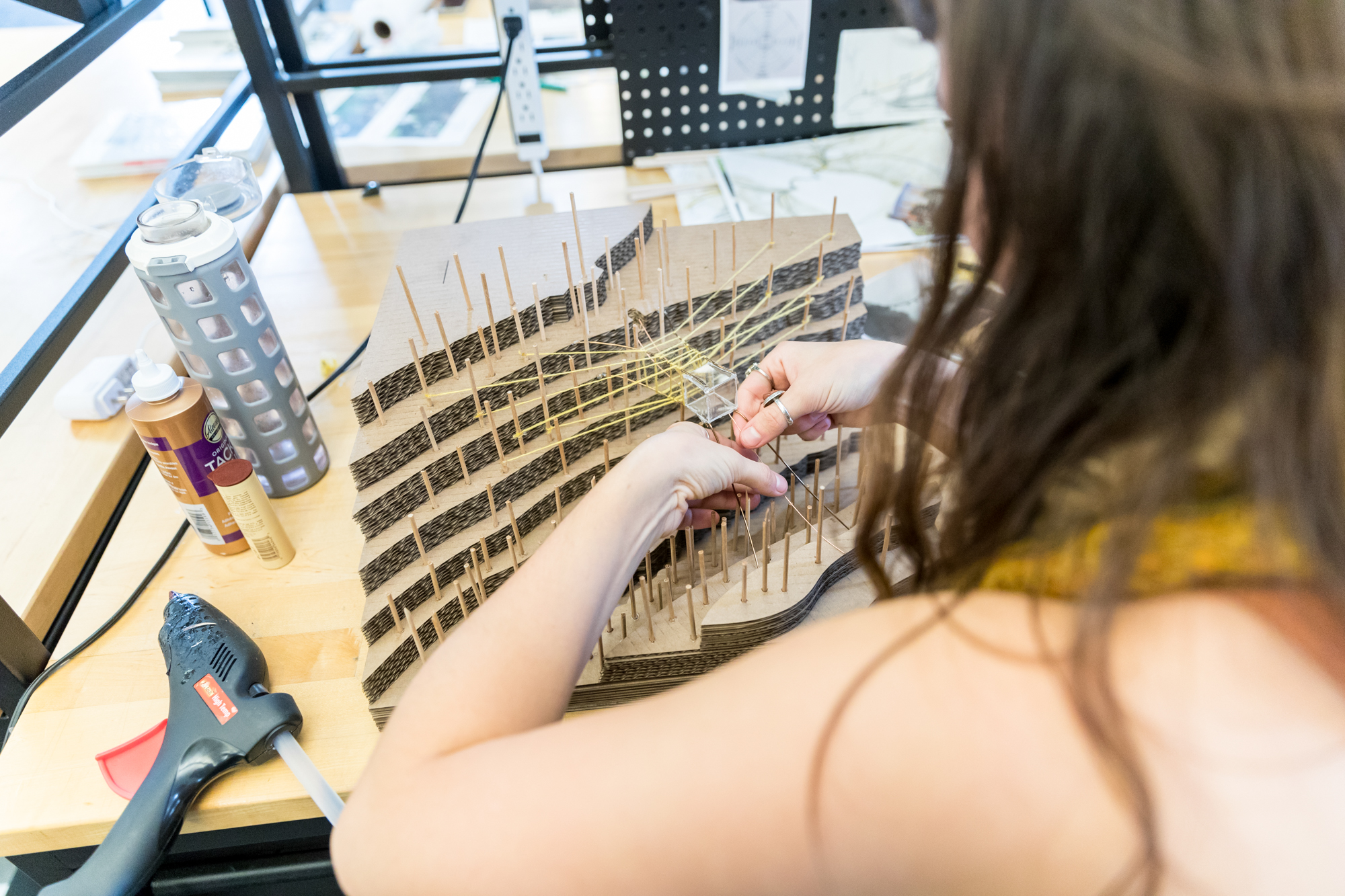 Landscape architecture student working on a model in the studio