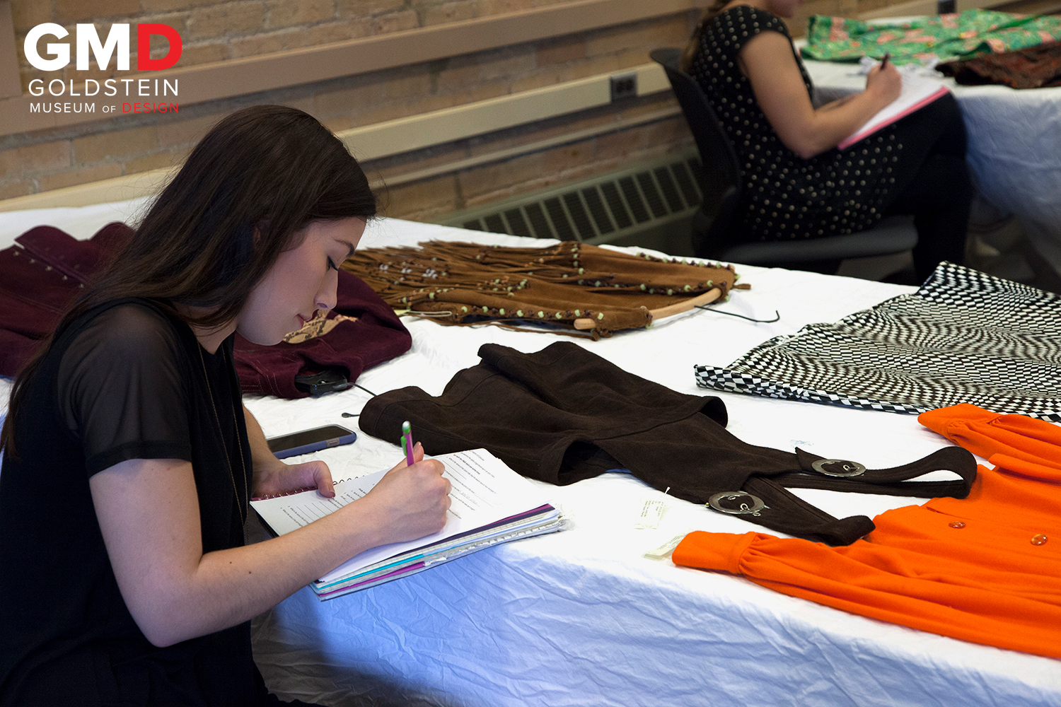 Student studying costume history in Goldstein Museum of Design