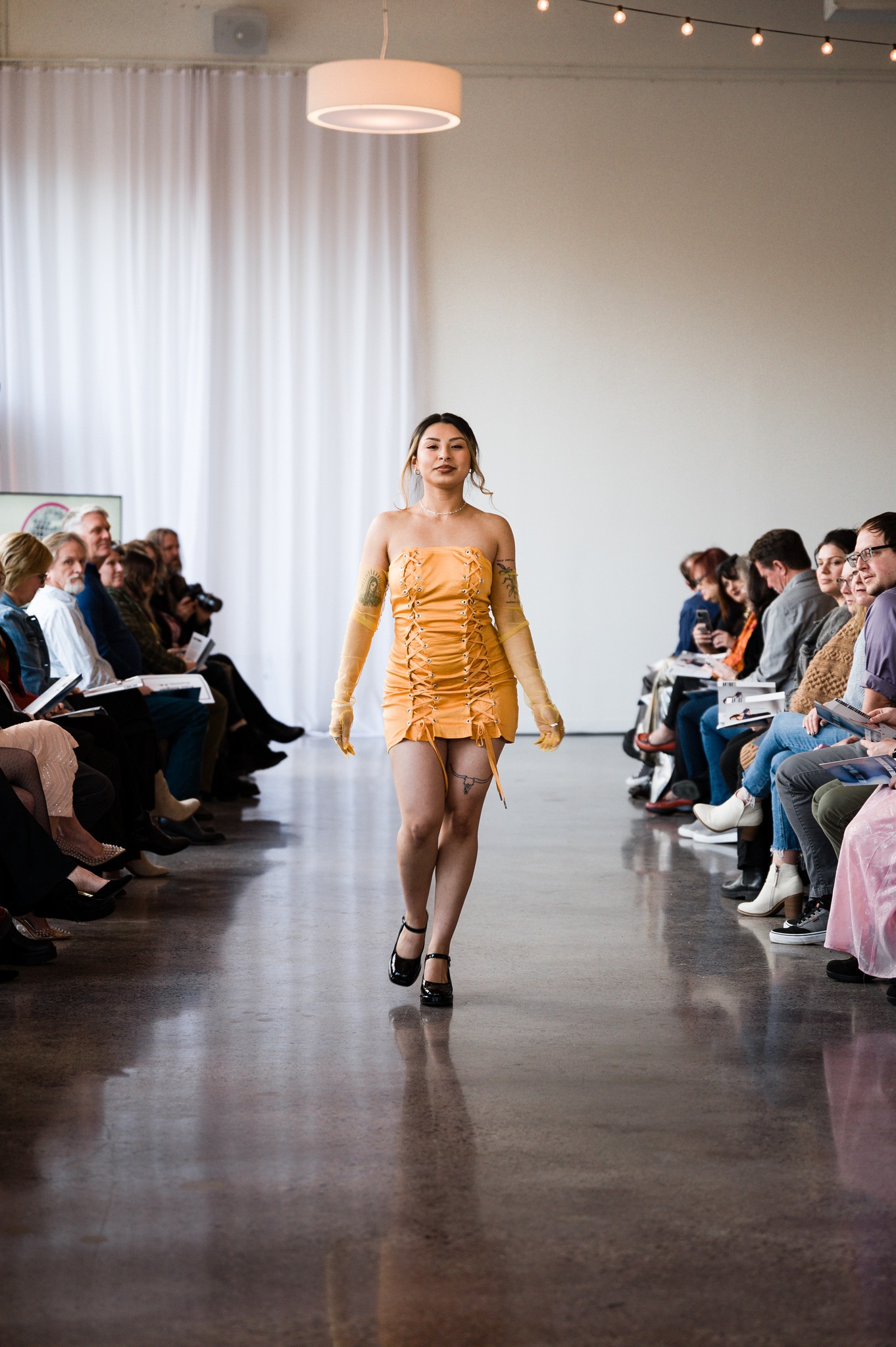 Model for Abby Harrold's line Antidote walks runway.