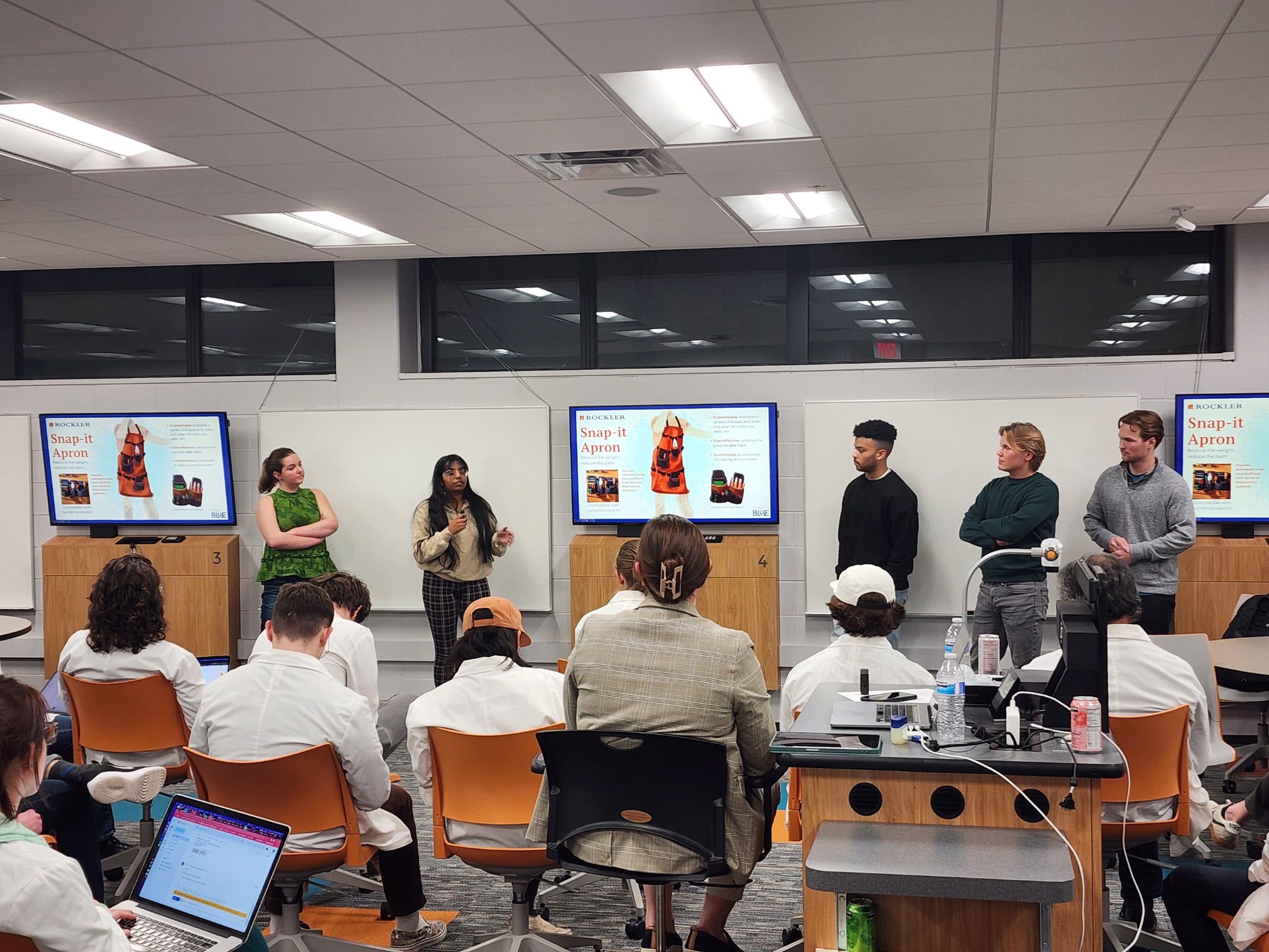 Product design students presenting in class.