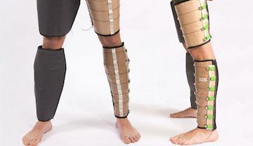 Two people wearing compression garments on legs.