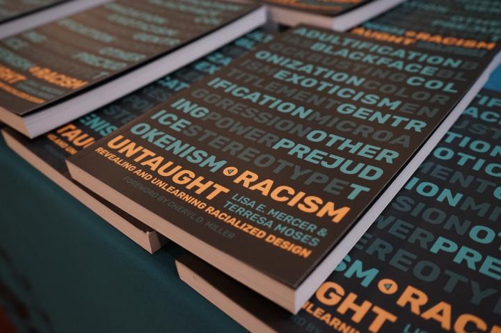 Copies of the book Racism Untaught.