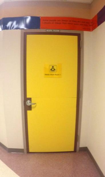 A photograph of a yellow painted door.